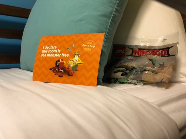 a lego bag on a bed