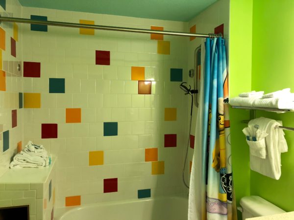 a bathroom with colorful tiles