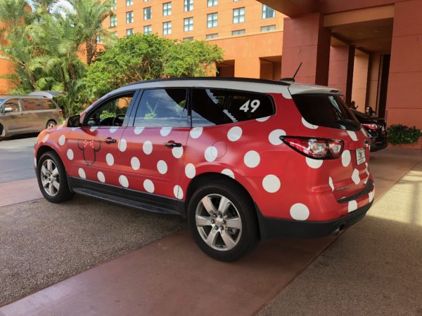 a red and white car with white dots on it