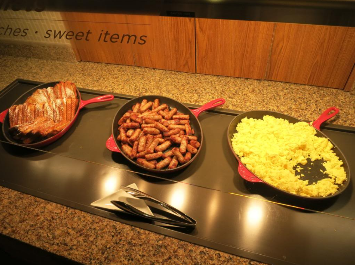 a group of pans of food on a counter