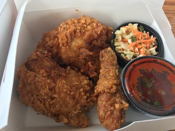a box of fried chicken and side dishes