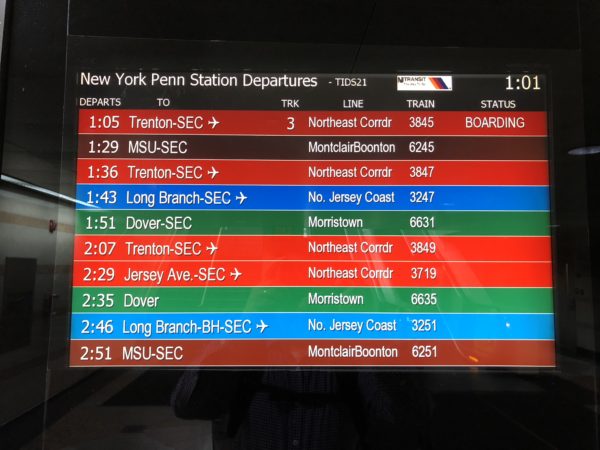 a screen with a number of trains and time zones