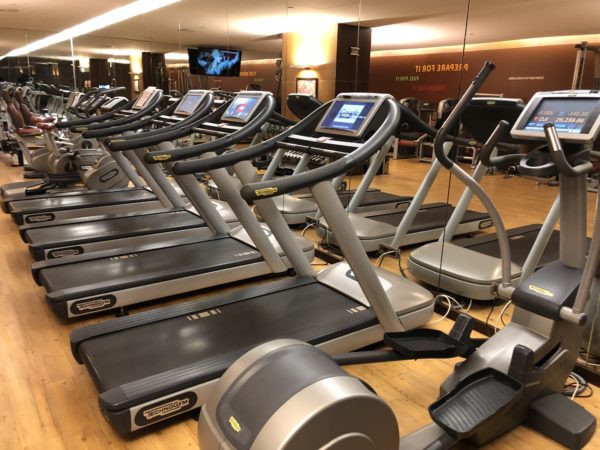 a group of treadmills in a gym