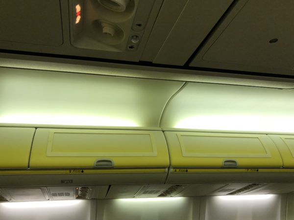 a yellow and white overhead storage