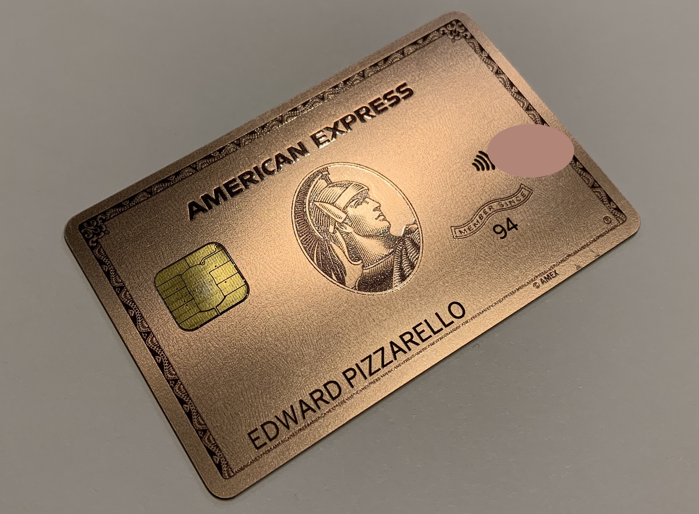a gold credit card with a chip and a chip