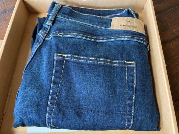 a pair of blue jeans in a box