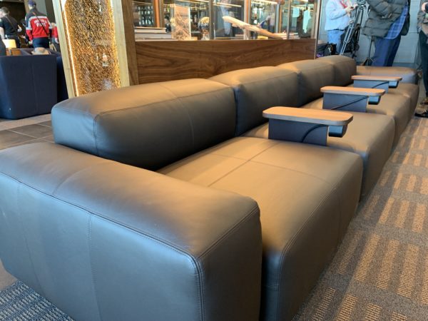 a couch with tables in the middle