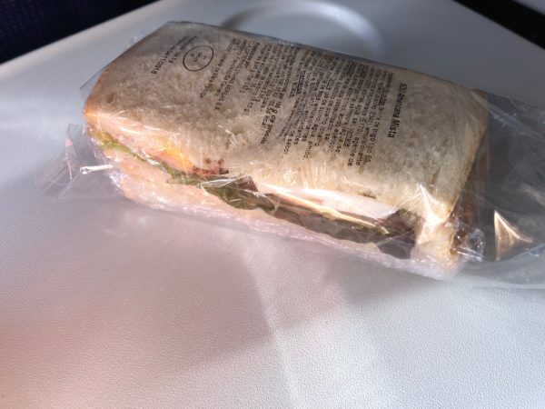 a sandwich in a plastic wrap