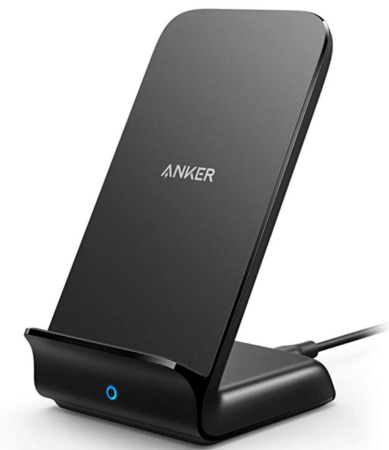 a black wireless charger with a blue light