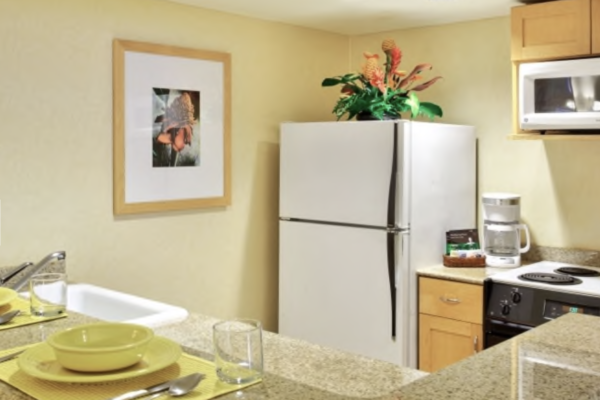 a kitchen with a white refrigerator