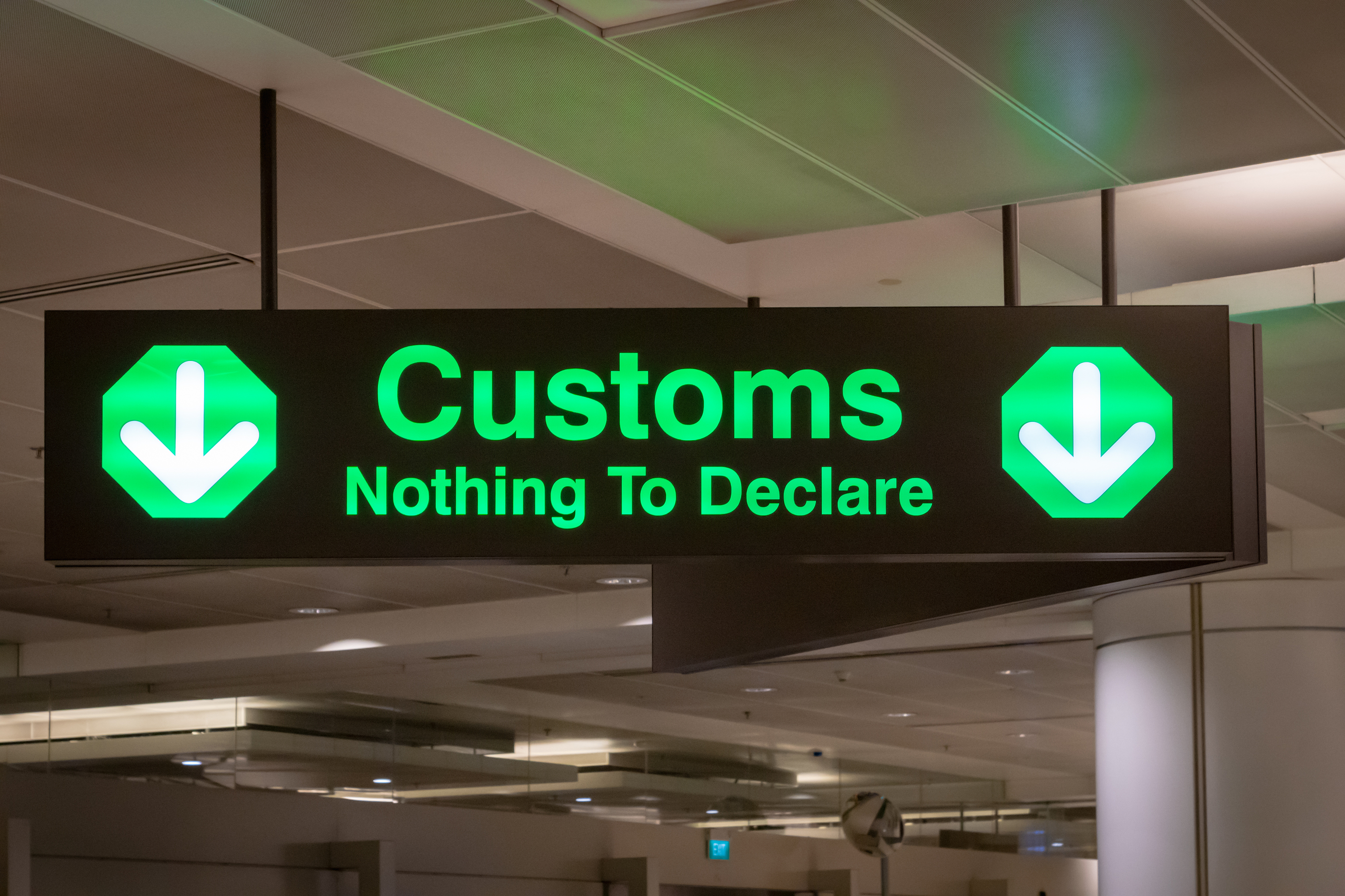 a sign with green text and arrows