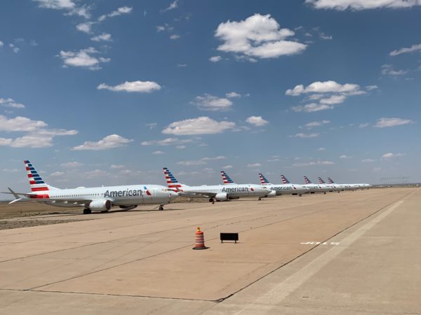 a row of airplanes on a runway