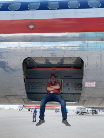 a man sitting in the back of an airplane
