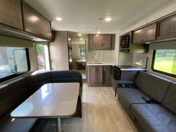 inside a rv with a table and couch