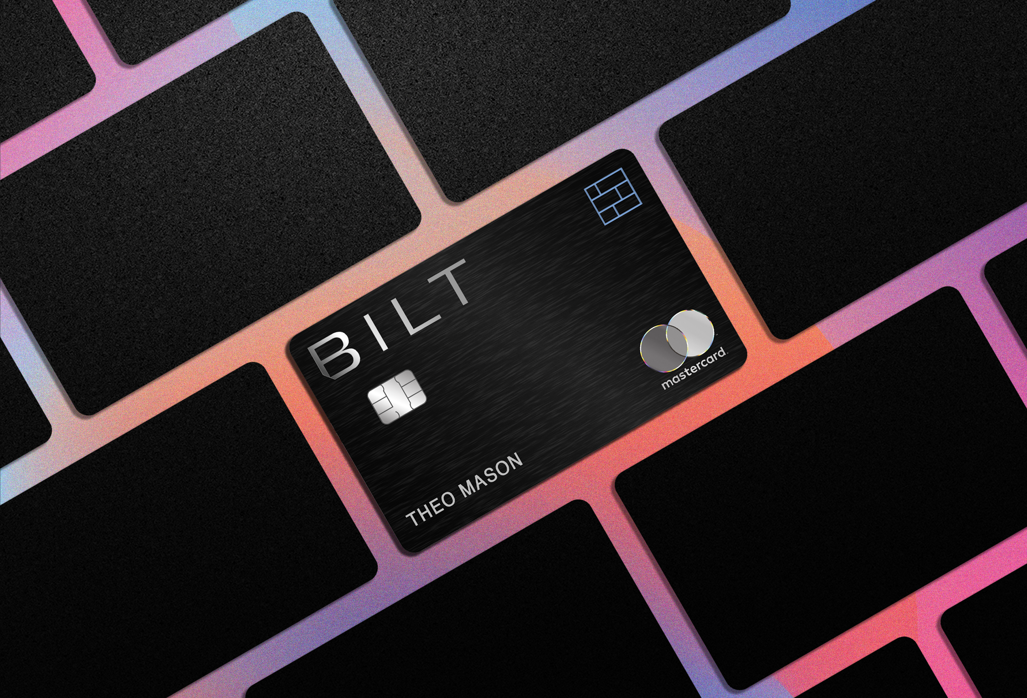 a black credit card on a keyboard